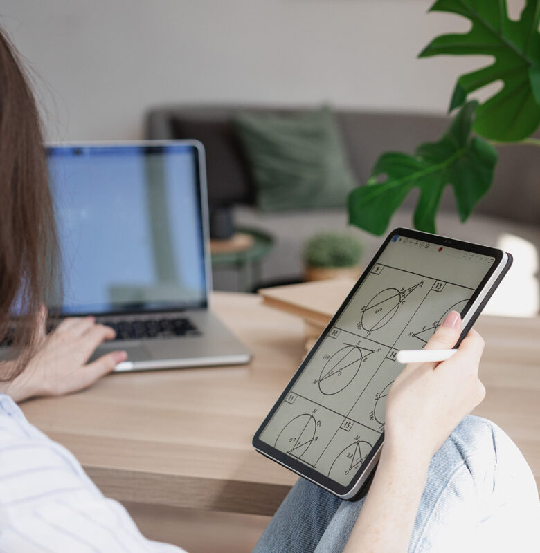 Young beautiful woman student with digital tablet and laptop stu Young beautiful woman student with digital tablet and laptop studying working at home